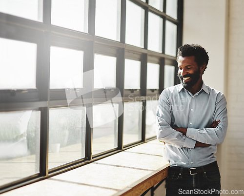 Image of Window, flare and a business man arms crossed in the office with a smile or mindset of future success. Happy, vision and corporate with a male employee standing in the workplace during his break