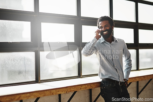 Image of Window, phone call or idea and a business man in the office with a smile while planning or networking. Happy, vision and mobile contact with a male employee standing in the workplace during his break