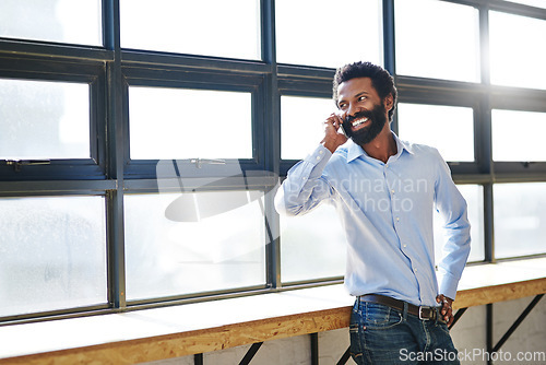 Image of Window, phone call and smile with a business man in the office for planning, communication or negotiation. Happy, thinking and mobile networking with a male employee in the workplace during his break