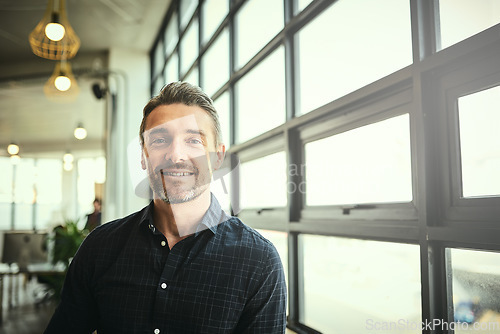 Image of Portrait, smile and happy man at office window, creative startup and business project for entrepreneur at design agency. Proud boss with creativity, job ideas and focus, businessman with confidence.