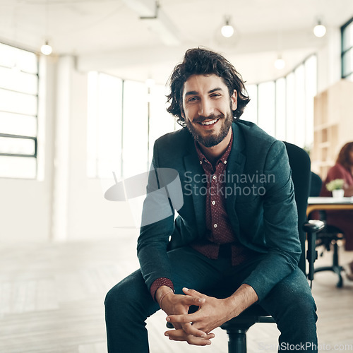 Image of Portrait, startup and smile, man in chair at office, creative ideas for business project or entrepreneur at design agency. Boss with creativity, idea and happiness, businessman with plan in workspace