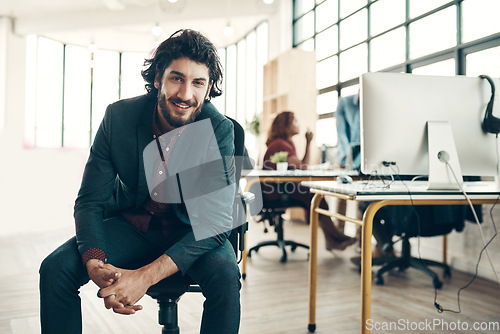 Image of Portrait, confidence and happy man in chair at coworking space, ideas for project and entrepreneur at design agency. Leader in creativity, idea and happiness, businessman with creative plan in office