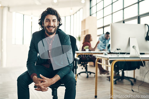 Image of Portrait, creative agency and smile, man in chair at office, new ideas for business and entrepreneur in tech design. Happy boss with creativity, idea and happiness, businessman with plan in workspace