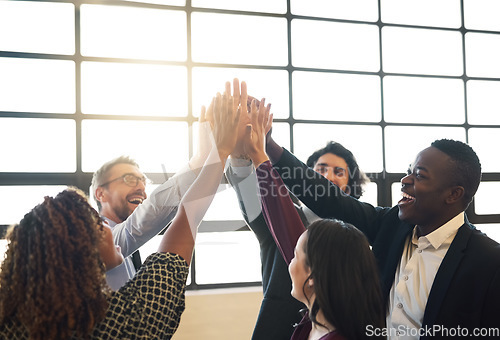 Image of Business people, group and high five for teamwork, collaboration or team building in office. Hands of diversity men and women together for corporate support, solidarity and mission or motivation