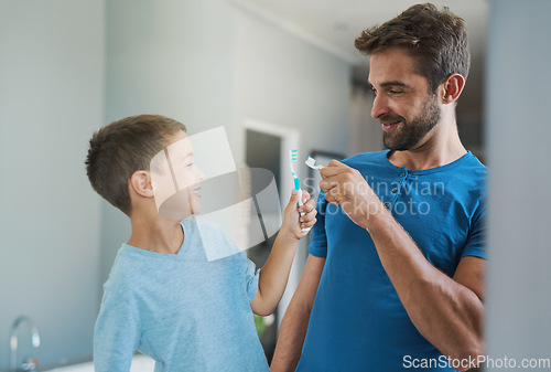 Image of Boom. Toothbrush, brushing teeth and father with son bathroom for morning routine, bonding and dental. Oral hygiene, cleaning and smile with man and child in family home for self care and wellness.