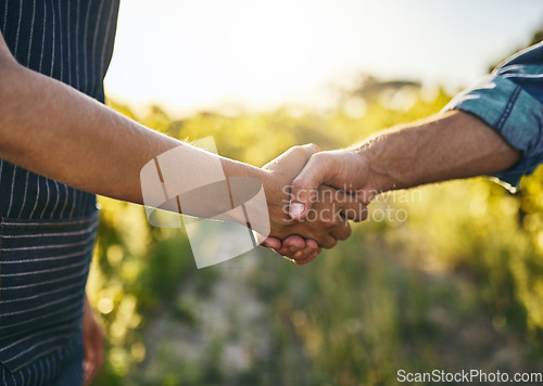 Image of Farmer teamwork, handshake and success for sustainability deal in the countryside on farm. Agriculture, thank you and collaboration agreement in nature with farming worker and sustainable business