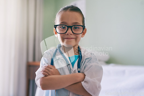 Image of Girl child, portrait and playing doctor with smile, glasses and stethoscope in home, hospital or clinic. Female kid, play medic and happy with excited face, learning and game for development in house