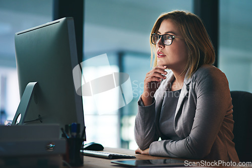 Image of Computer, problem solving and business woman in office working late on project at night alone. Desktop, professional and female person thinking, focus or solution, planning and reading on deadline.