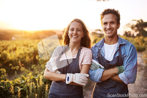 Image of Happy couple, arms crossed and portrait at farm, outdoor agriculture for plants, food and vegetables. Woman, man and together in countryside, garden or farming with happiness, start or sustainability