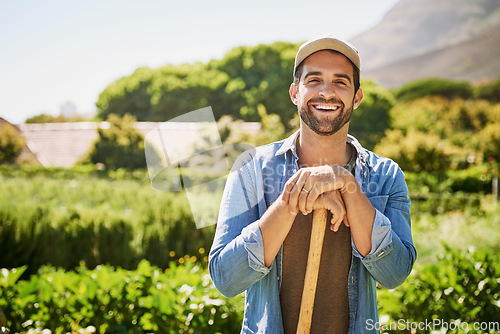 Image of Farming, spade and portrait of man or farmer in agriculture, sustainable garden or small business owner in field. Farm, land and face of happy person with plants, eco friendly and agro sustainability