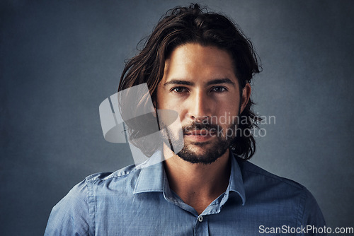 Image of Beard, long hair and portrait of business man with confidence on gray studio background. Face, businessman and model with professional style of entrepreneur, manager or formal corporate worker