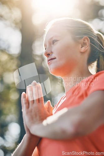 Image of Hands, yoga and meditation with woman, praying with fitness outdoor and wellness, spiritual and low angle. Sunshine, female person meditate and zen with exercise, healing and mindfulness with prayer
