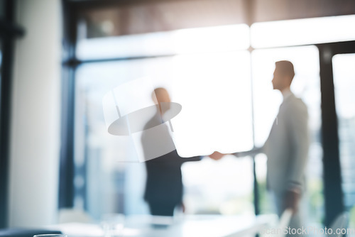 Image of Business people, handshake and partnership for meeting, hiring or b2b deal agreement at office. Businessman shaking hands in recruiting, teamwork or collaboration with blurred background at workplace