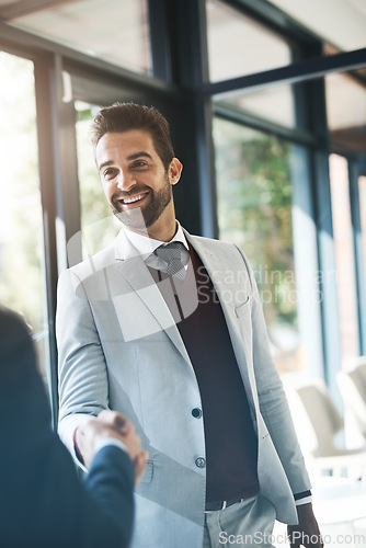 Image of Businessman, handshake and partnership in meeting for deal, b2b agreement or hiring at the office. Happy business people shaking hands in recruiting, teamwork or welcome introduction at the workplace