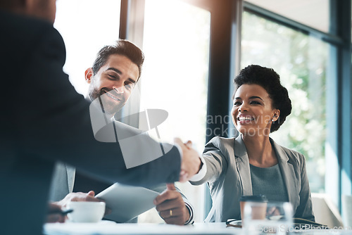 Image of Business people, handshake and meeting for partnership, teamwork or collaboration in boardroom at office. Happy woman shaking hands in team recruiting, introduction or b2b agreement at the workplace