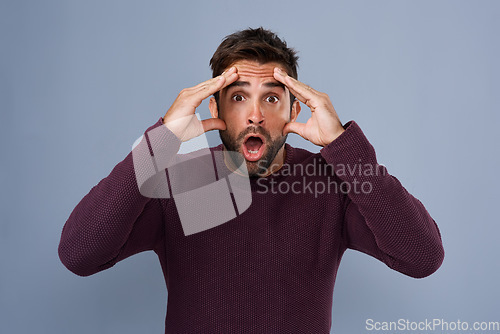 Image of Portrait, wow and man in studio mind blown by gossip, drama or secret against grey background. Omg, face and surprised male with wtf expression for fake news, announcement and rumor while isolated