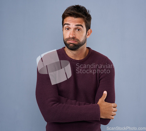 Image of Unsure, confused and portrait of man in studio with confused, uncertain and thoughtful on blue background. Thinking, mockup space and face of male person skeptical for decision, choice and question