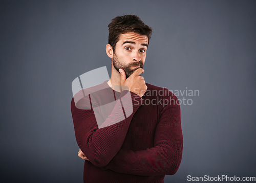 Image of Doubt, thinking and portrait of man with unsure, uncertain and thoughtful on gray background. Wondering, mockup space and face of male person confused for decision, choice and question in studio