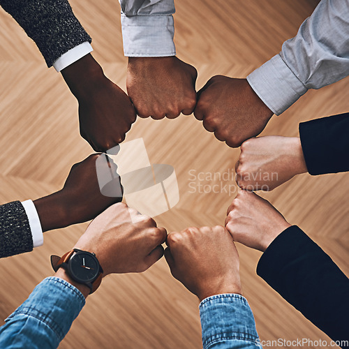 Image of Team building, fist bump or hands of business people for motivation, group support or community in office. Teamwork, above or circle of fists for diversity, collaboration or partnership for a mission