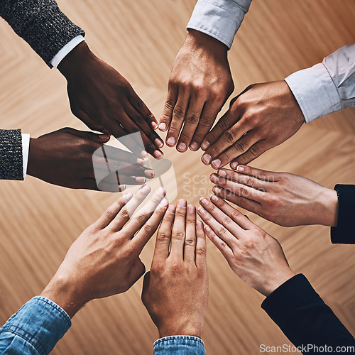 Image of Above, community or hands of business people for support, teamwork or group collaboration in office. Zoom, diversity or employees with diversity, inclusion or mission for partnership goals together