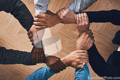 Image of Solidarity, holding or hands of business people with diversity for group support or teamwork in office. Community, link or above group of employees with mission or team building for goals together