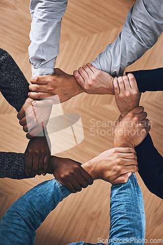 Image of Collaboration, holding or hands of business people with diversity for office support or teamwork. Zoom, link or above of group of employees with mission or team building for startup goals together