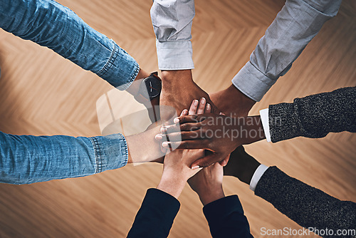 Image of Diversity, faith or hands of business people in support for love, teamwork or community strategy in office. Closeup, above or employees in group collaboration with hope or mission for goals together