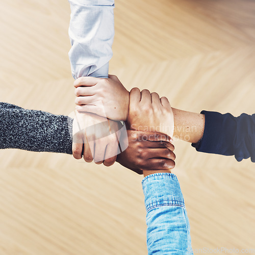 Image of Teamwork, link or hands of business people with diversity for community support or strategy in startup office. Zoom, above or employees in group collaboration or mission with hope for goals together