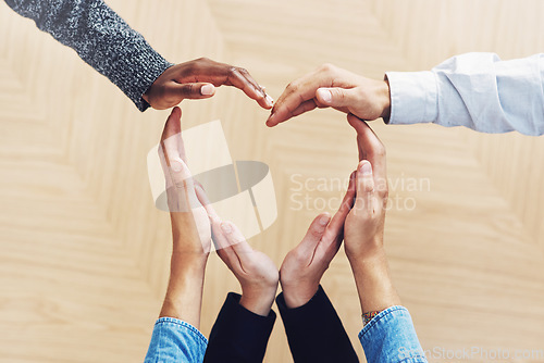 Image of Teamwork, heart or hands of business people in support for trust, diversity or community inclusion in office. Love gesture, above or employees in group collaboration with hope or kindness for charity