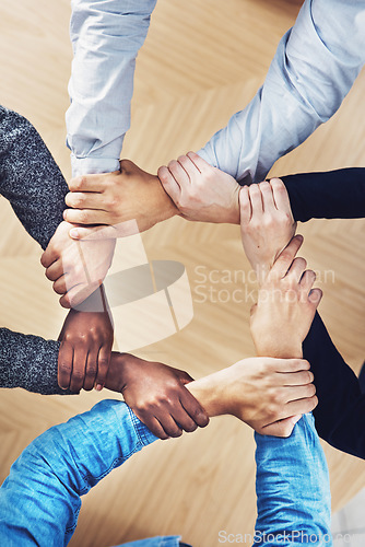 Image of Teamwork, holding or hands of business people with diversity for office support or collaboration. Trust, link or above of group of employees with mission or team building for startup goals together