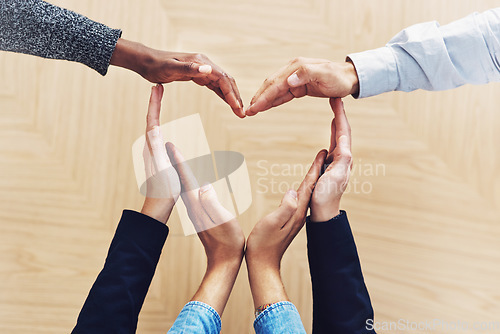 Image of Community, heart or hands of business people in support for trust, teamwork or diversity inclusion in office. Love gesture, above or employees in group collaboration with hope or kindness for charity