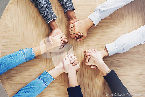 Image of Above, teamwork or business people holding hands for support, team building or community in office. Motivation, trust or employees in group collaboration with diversity or mission for goals together