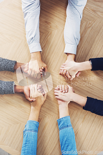 Image of Above, solidarity or business people holding hands for support, team building or teamwork in office. Partnership, zoom or employees in group collaboration with diversity or mission for goals together
