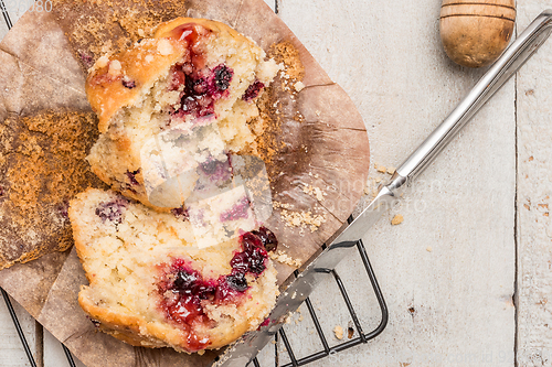 Image of Muffins with red fruits jam fill.