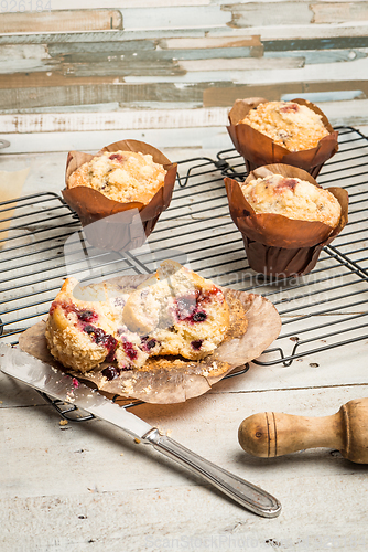 Image of Muffins with red fruits jam fill.