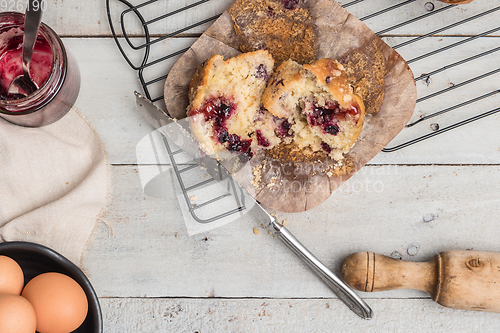 Image of Muffins with red fruits jam fill.