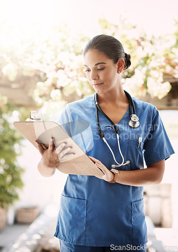 Image of Woman doctor, clipboard and check documents for medical service, hospital paperwork and nursing registration or information. Report, analysis and professional nurse or healthcare person and checklist