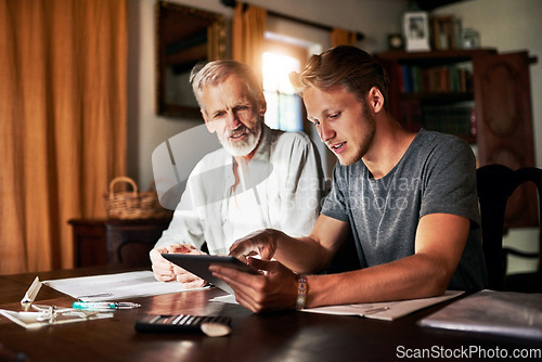Image of Tablet, investment or retirement with a father and son in their home for savings, budget or finance planning. Accounting, money or insurance with a man helping his senior pensioner parent in the home