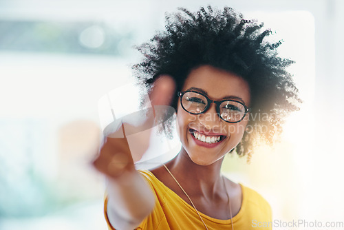 Image of Woman, thumbs up and happy portrait with a smile for support, thank you or yes. Face of a female model person with glasses, happiness and hand for like, agreement or feedback icon, sign or emoji