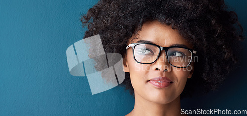 Image of Optometry, vision and female model with glasses in studio with thinking, pensive or idea face expression. Optical wellness, healthcare and African woman with spectacles by blue background with mockup