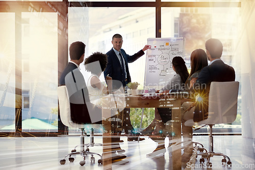 Image of Meeting, presentation and overlay with a business man talking to his team in the office during a workshop. Planning, strategy or coaching with a male manager teaching his staff about company vision