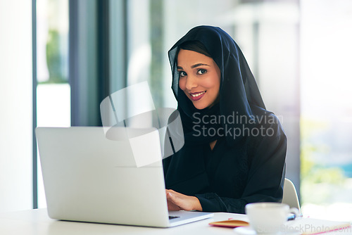 Image of Entrepreneurship, laptop and woman in portrait with muslim from dubai with a smile for technology. Business, laptop and professional in hijab at an office for a career at an agency for web design.