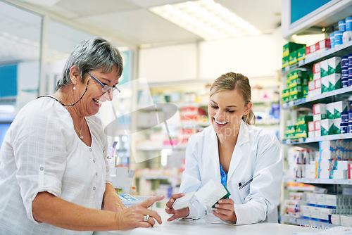 Image of Pharmacist explaining prescription medication to woman in the pharmacy for pharmaceutical healthcare treatment. Medical, counter and female chemist talking to patient on medicine in clinic dispensary