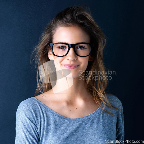 Image of Studio, teenager or portrait of a girl for fashion, beauty or eyewear with vision isolated on dark background. Style, happy or face of a beautiful young woman or confident model with glasses or smile