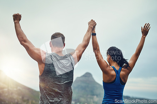 Image of Couple, celebration and arms up in nature for training, workout or exercise to run a marathon, competition or tournament. People, winning and happy for freedom, sports goal or achievement