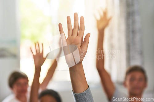 Image of Question, school and hands of children in classroom for answer in lesson, learning and education. Child development, knowledge and young students with hand raised for asking, feedback and questions