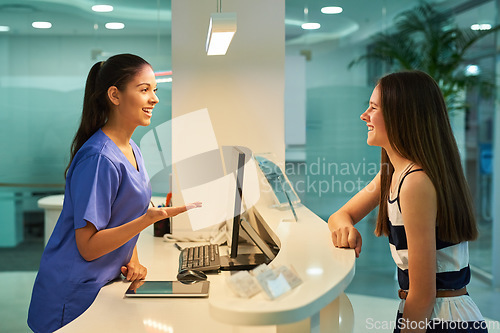 Image of Medical, reception and nurse with patient in hospital for advice, help and information. Medicine, happy and healthcare with women at desk in clinic for nursing, waiting room and service