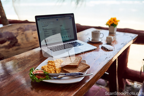 Image of Cafe food, laptop or breakfast by a beach for remote workspace in the morning with connection. Desk, seaside restaurant or table in coffee shop for digital blog online with brunch meal or lunch