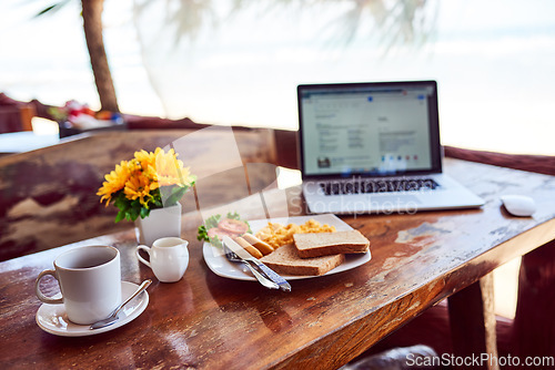 Image of Laptop, travel or empty table at cafe for remote workspace in the morning with connection. Background, internet or seaside view coffee shop for digital blog online with brunch meal, tea or food