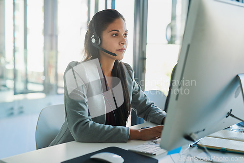 Image of Call center, computer and consulting with woman in office for customer support, advisory and online. Technology, internet and receptionist with employee at desk for contact us, communication and crm